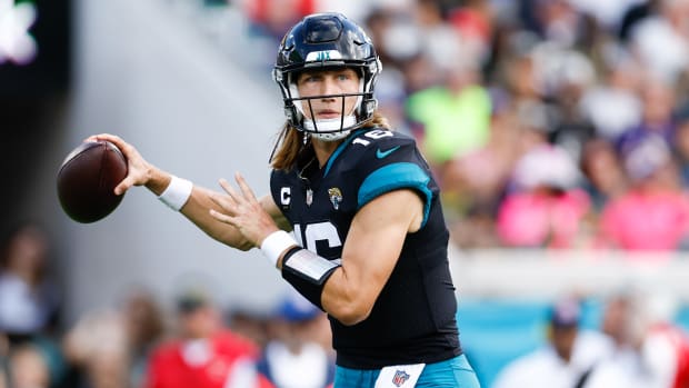 Jaguars quarterback Trevor Lawrence looks to throw the ball.